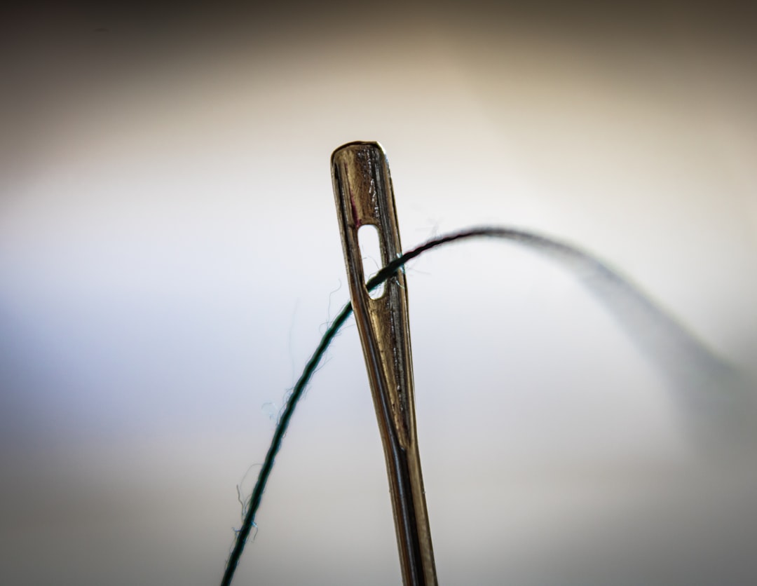 brown-wooden-clothes-pin-on-white-surface-c2qbma-nhye